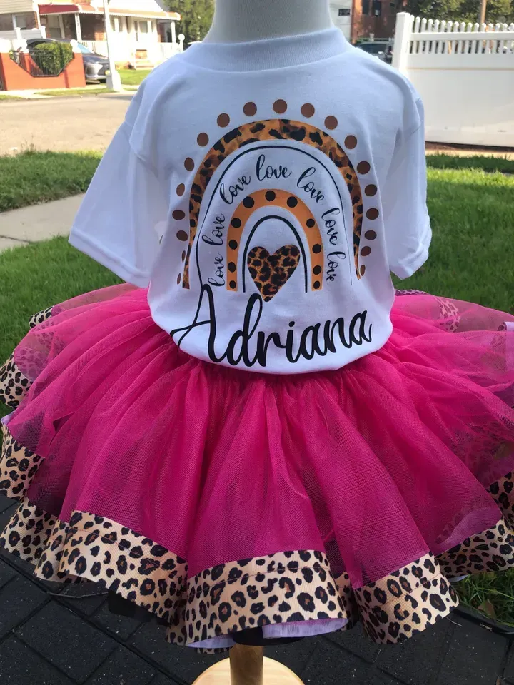 White t-shirt and pink tutu for a child with a rainbow design and the name
