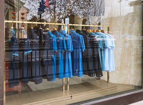 Blue Mens Shirt Display on The Storefront — Muncie, IN — Crystal Glass Inc.