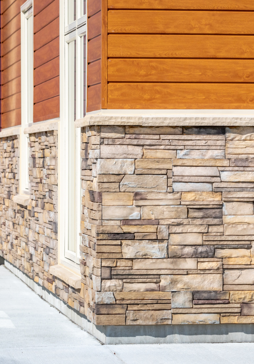 Yellow horizontal wood siding.
