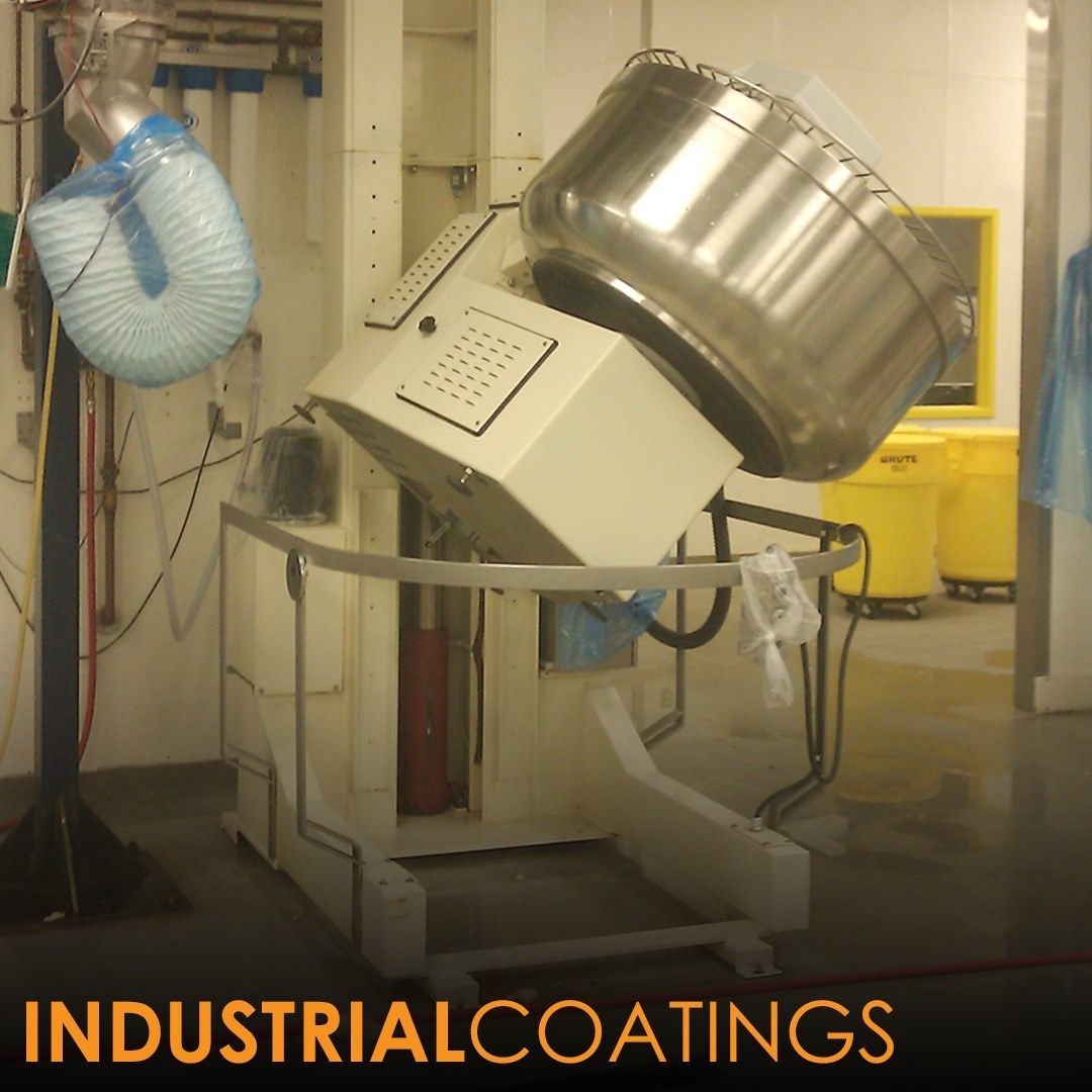 Large industrial mixing machine tilting, stainless steel bowl, white and gray. 