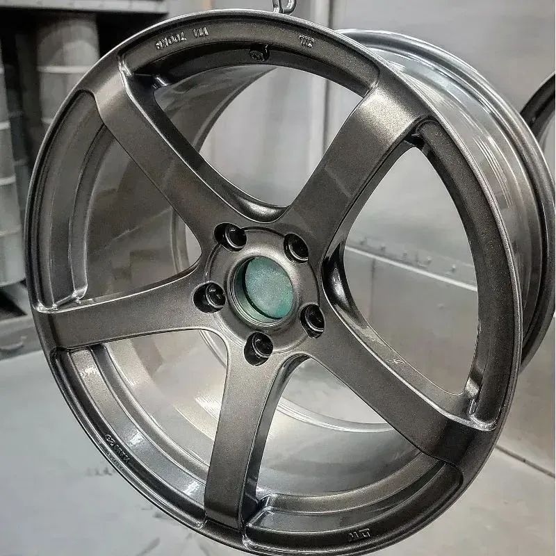 Gray five-spoke alloy wheel with a metallic finish, likely newly painted.