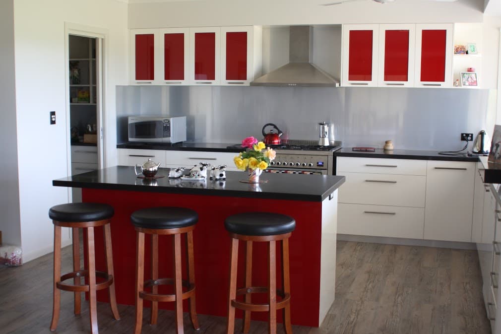 Glass Splashback with Red and White Cabinets — Crispin Cabinetmakers in South Grafton, NSW