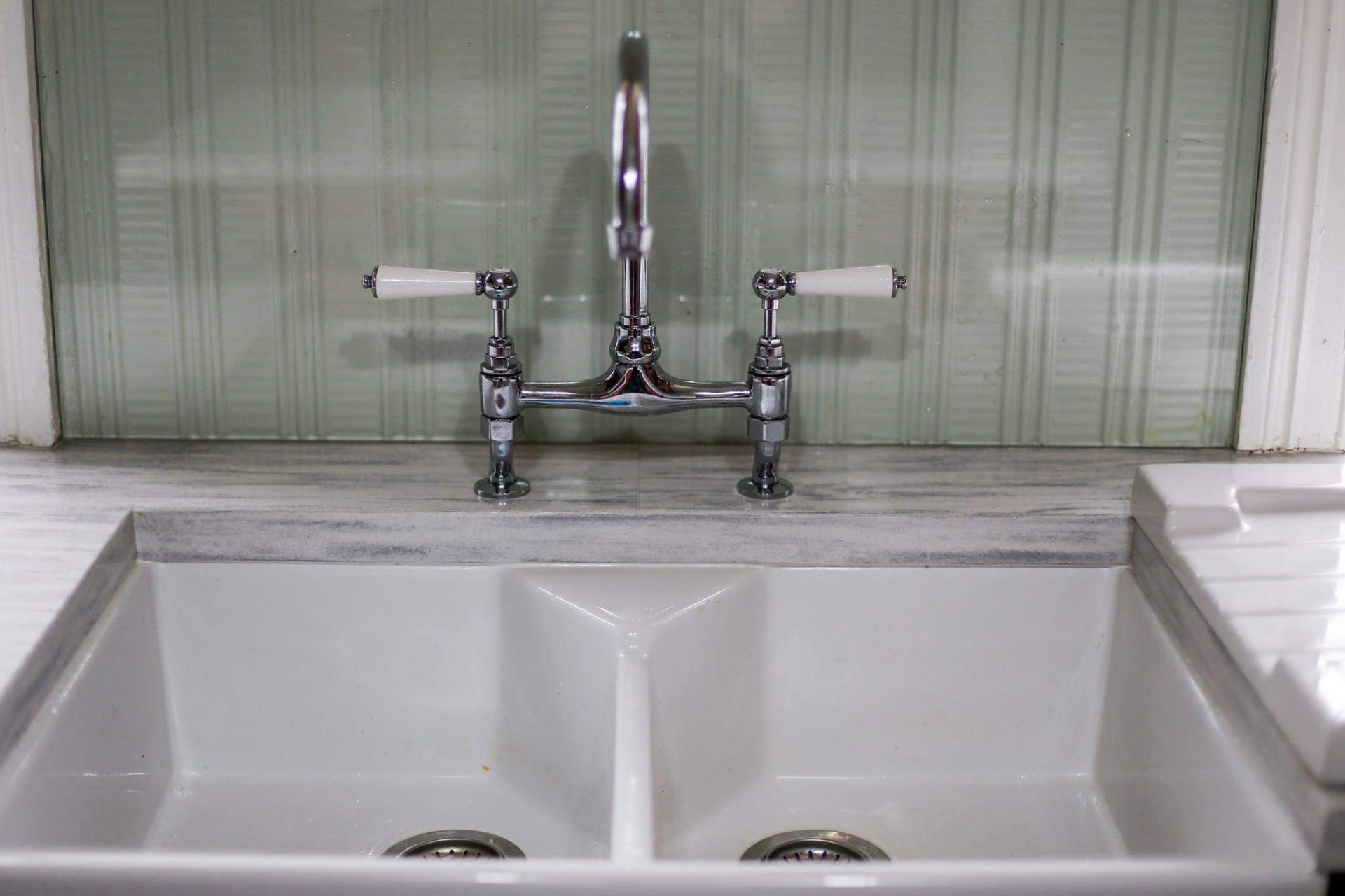 A Kitchen Sink With Two Sinks and a Faucet — Crispin Cabinetmakers in Maclean, NSW