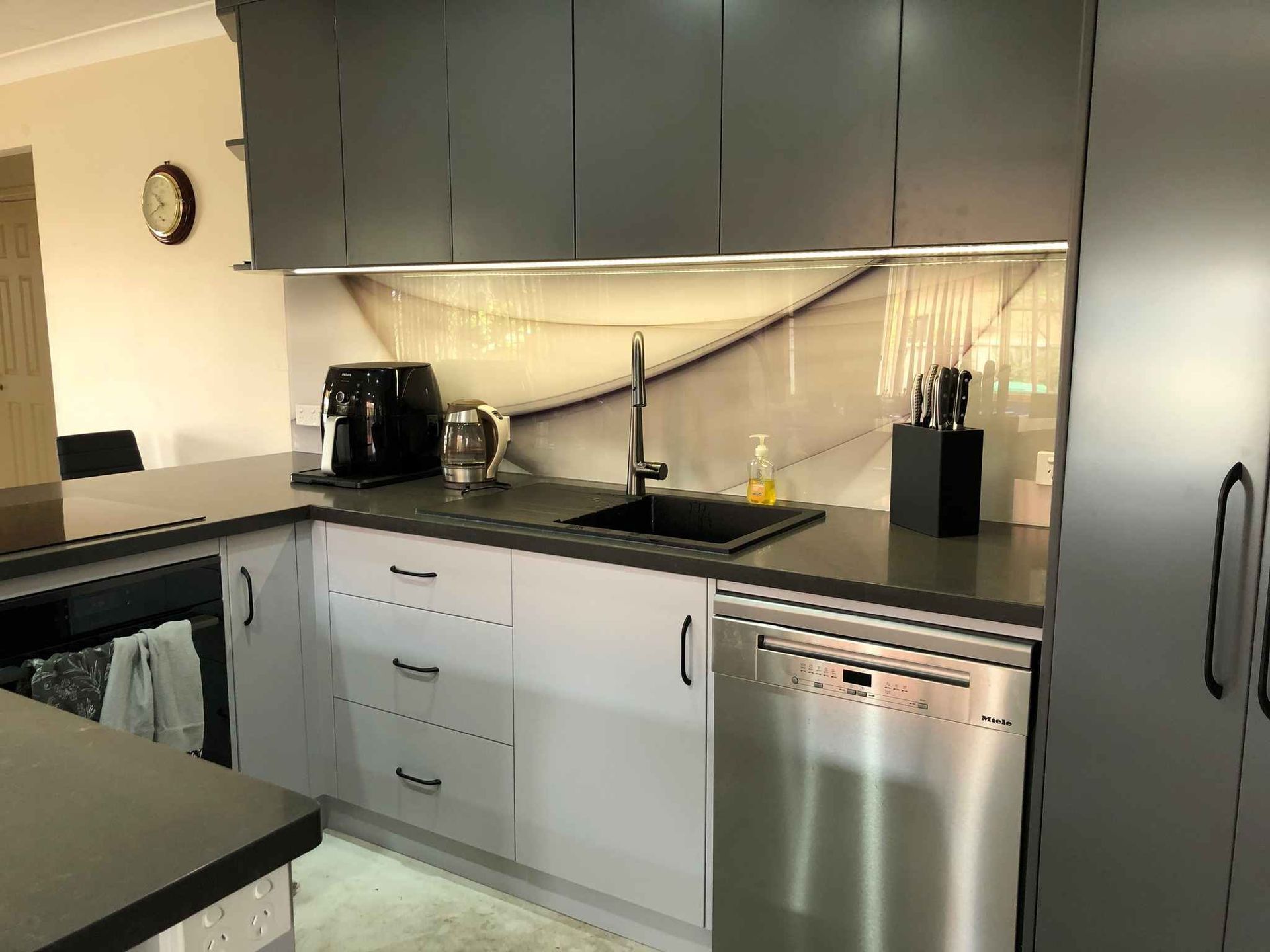 A Kitchen With Stainless Steel Appliances and a Sink — Crispin Cabinetmakers in Maclean, NSW