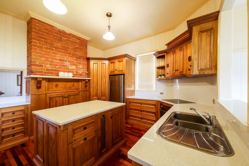 Wooden Kitchen Furniture with White Marble Countertop — Crispin Cabinetmakers in South Grafton, NSW