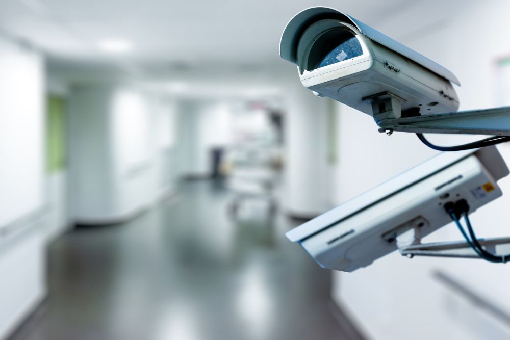 Two Security Cameras Are Sitting in a Hallway in a Hospital — Darwin Lock & Key In Nightcliff, NT