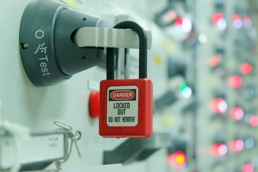 A Red Danger Padlock is Hanging on a Control Panel — Darwin Lock & Key In Berrimah, NT