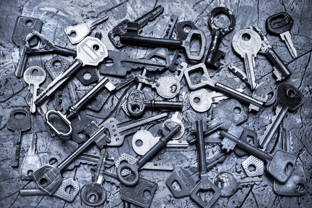 A Bunch of Keys Are Sitting on Top of Each Other on a Table — Darwin Lock & Key In Berrimah, NT