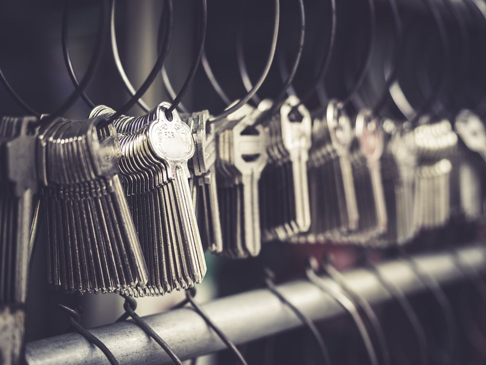 A Bunch of Keys Hanging on a Wire Rack — Darwin Lock & Key In Yarrawonga, NT