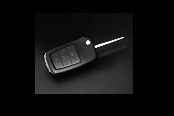 A Close Up of a Car Key on a Black Surface — Darwin Lock & Key In Coconut Grove, NT