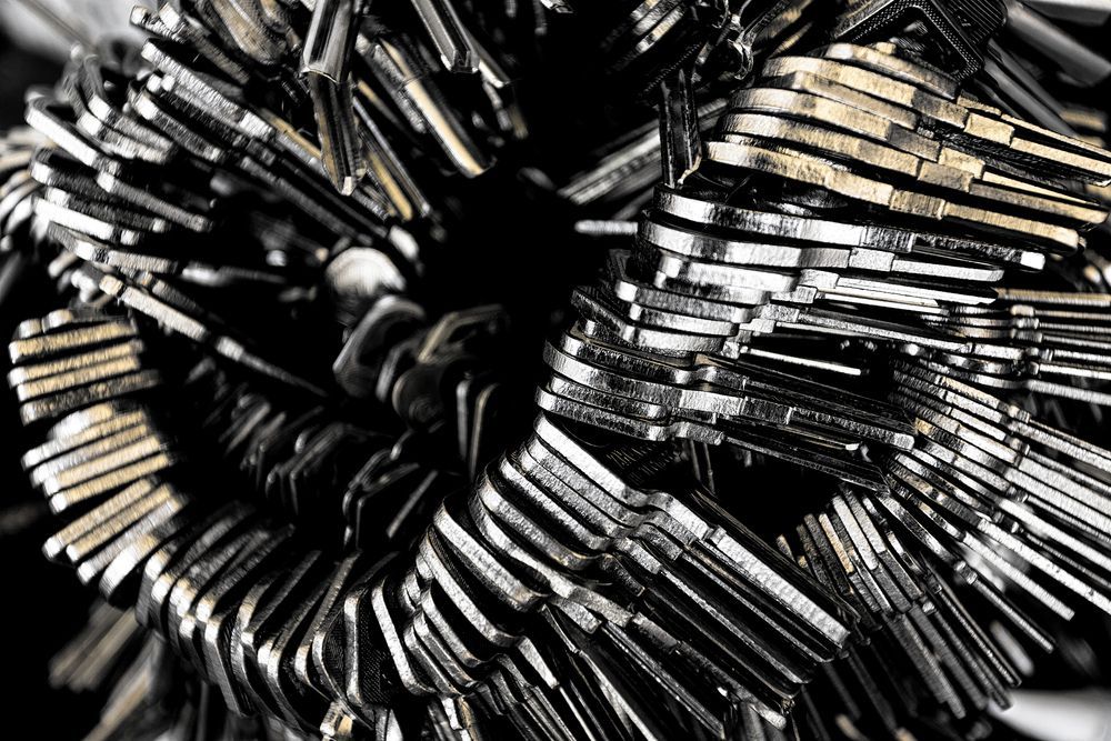 A Bunch of Keys Are Stacked on Top of Each Other on a Table — Darwin Lock & Key In Humpty Doo, NT