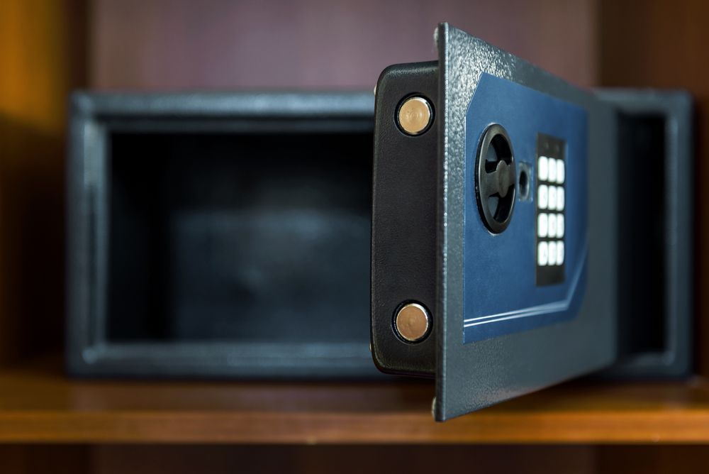An Open Safe is Sitting on Top of a Wooden Shelf — Darwin Lock & Key In Casuarina, NT