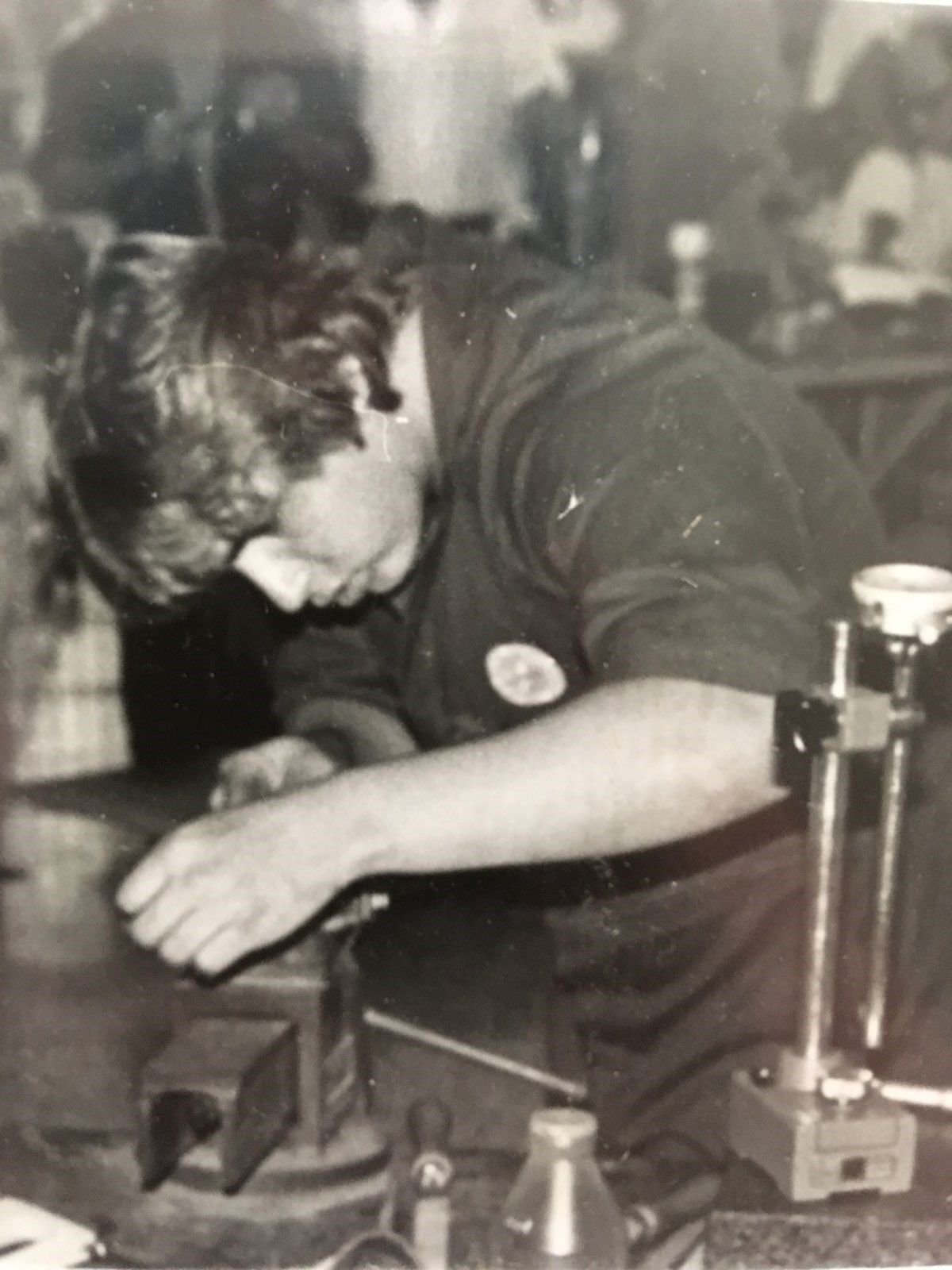 A Black and White Photo of a Man Working on a Machine — Darwin Lock & Key In Coconut Grove, NT