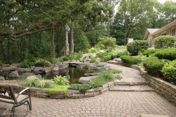 There is a pond in the middle of the garden.