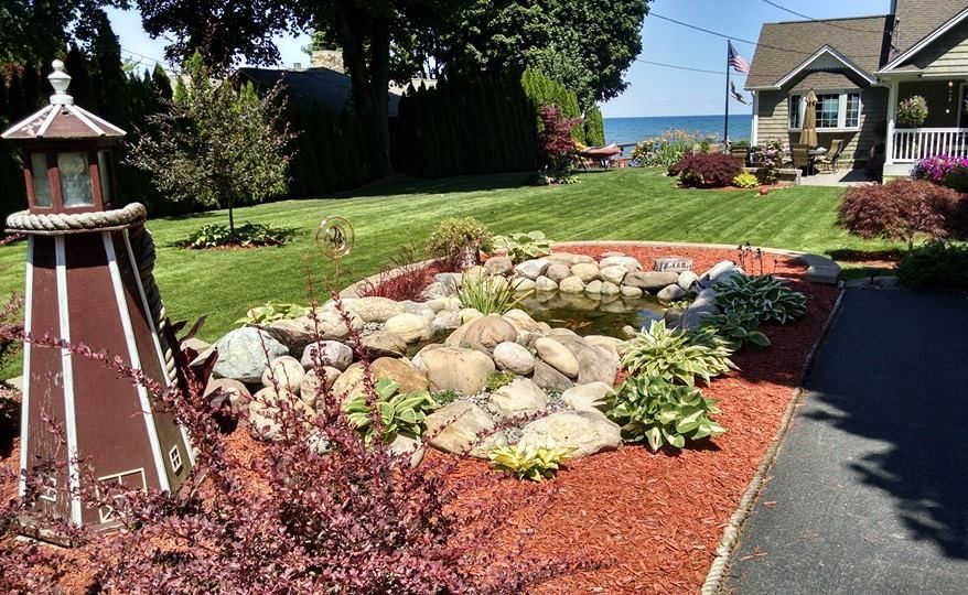 A house with a lighthouse in front of it