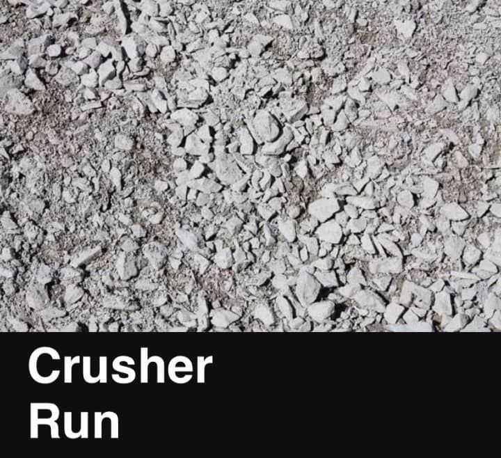 A close up of a pile of crushed rocks that says crusher run