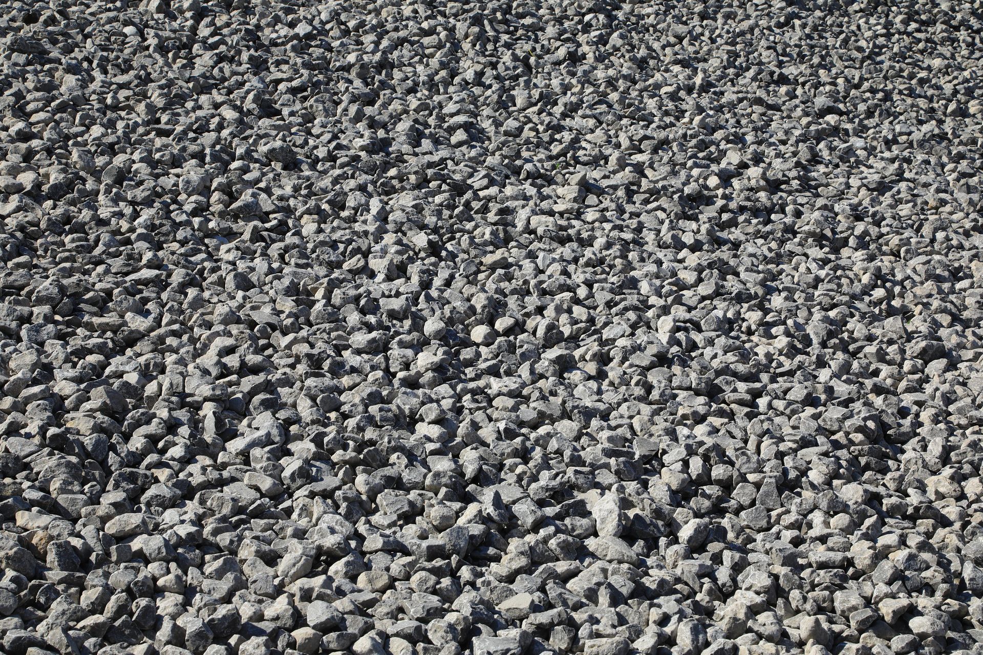 Empty gravel parking lot provided by gravel supplier services.