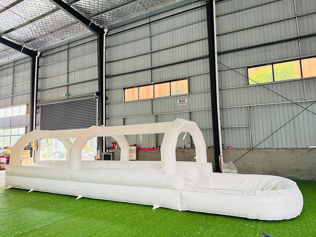 A large inflatable slide is sitting inside of a building.