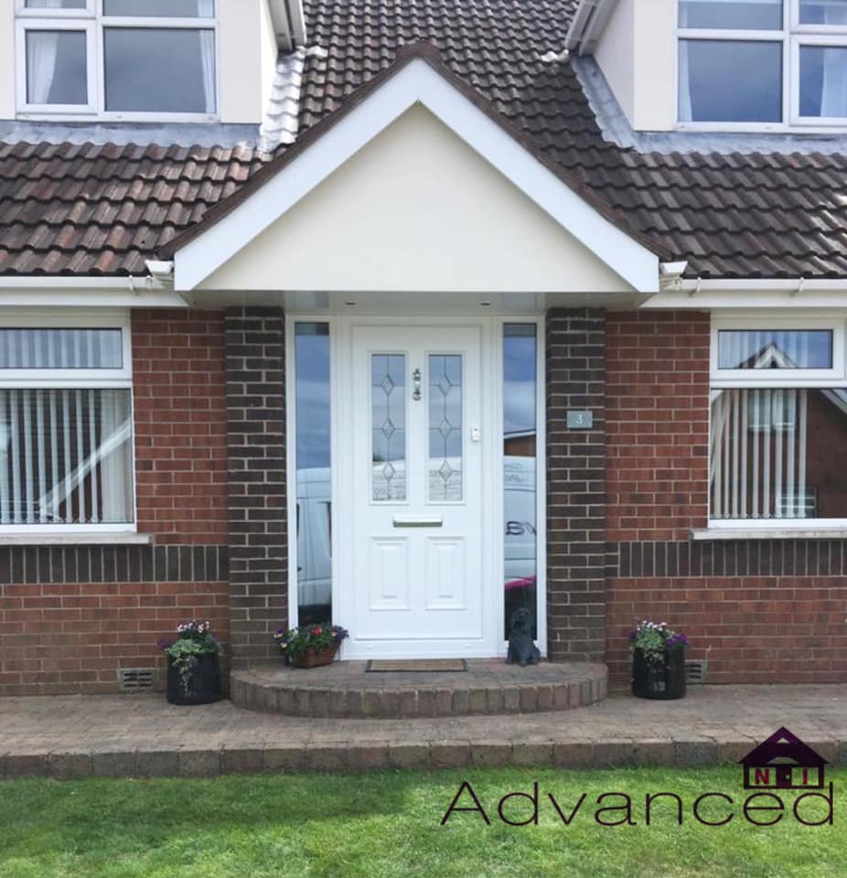 The front of a brick house with a white door