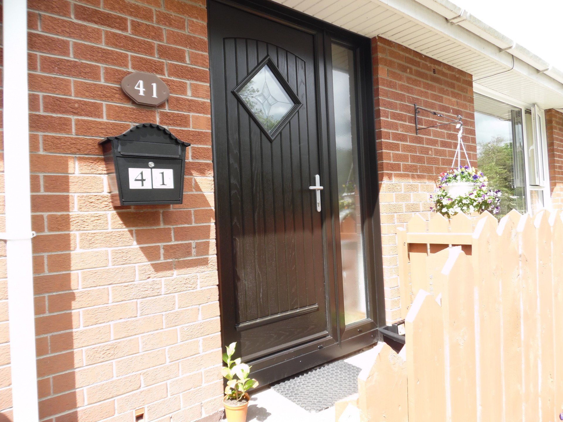 black composite front door with window