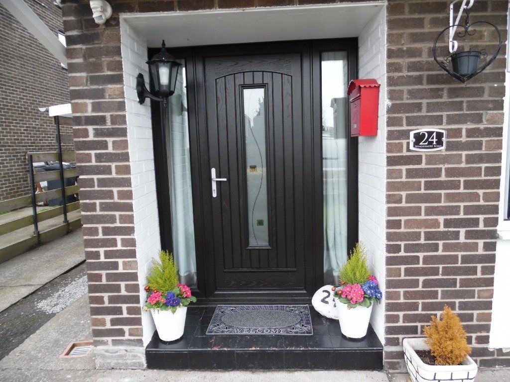 black composite door with side panels
