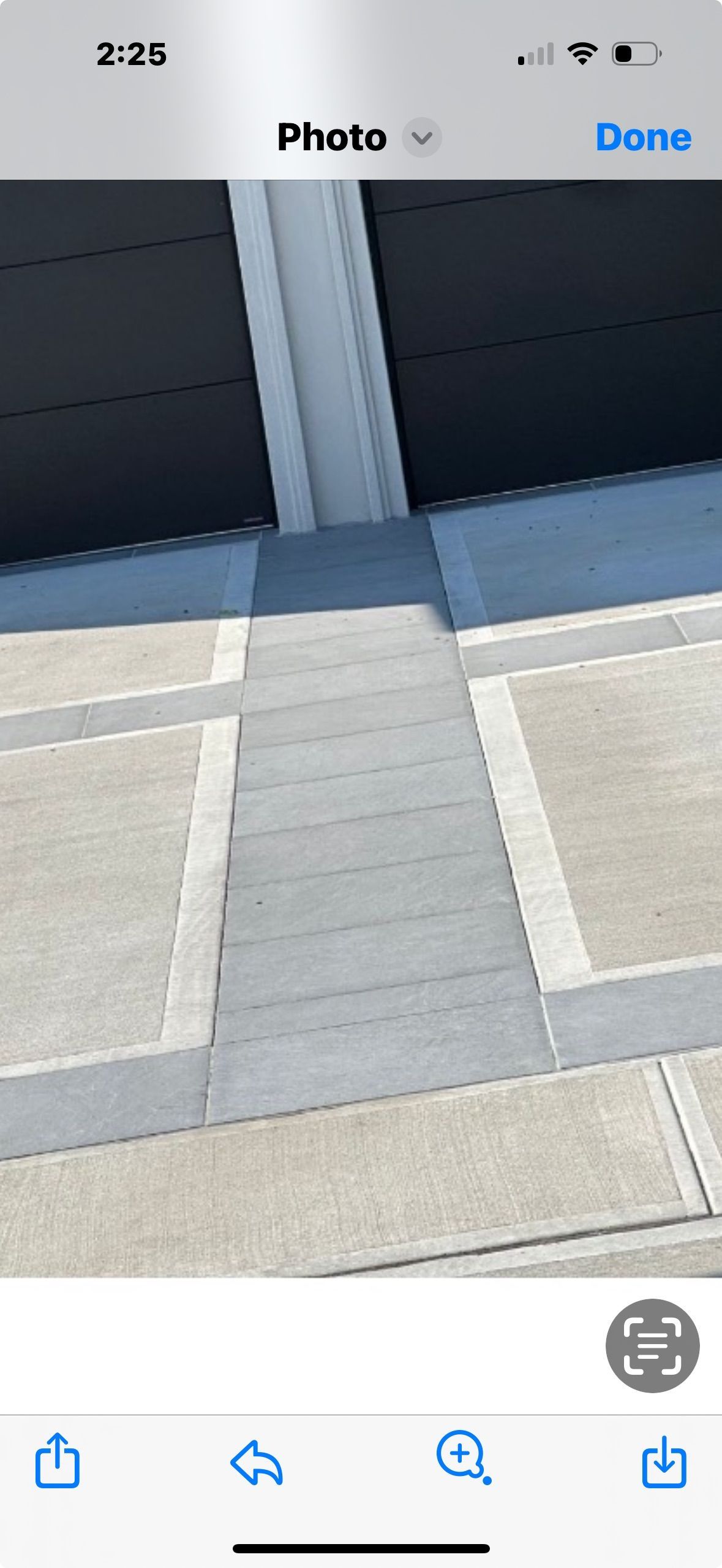 A phone screen shows a picture of a staircase leading up to a building.