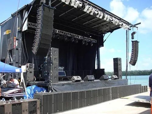 A large stage with a lot of speakers on it