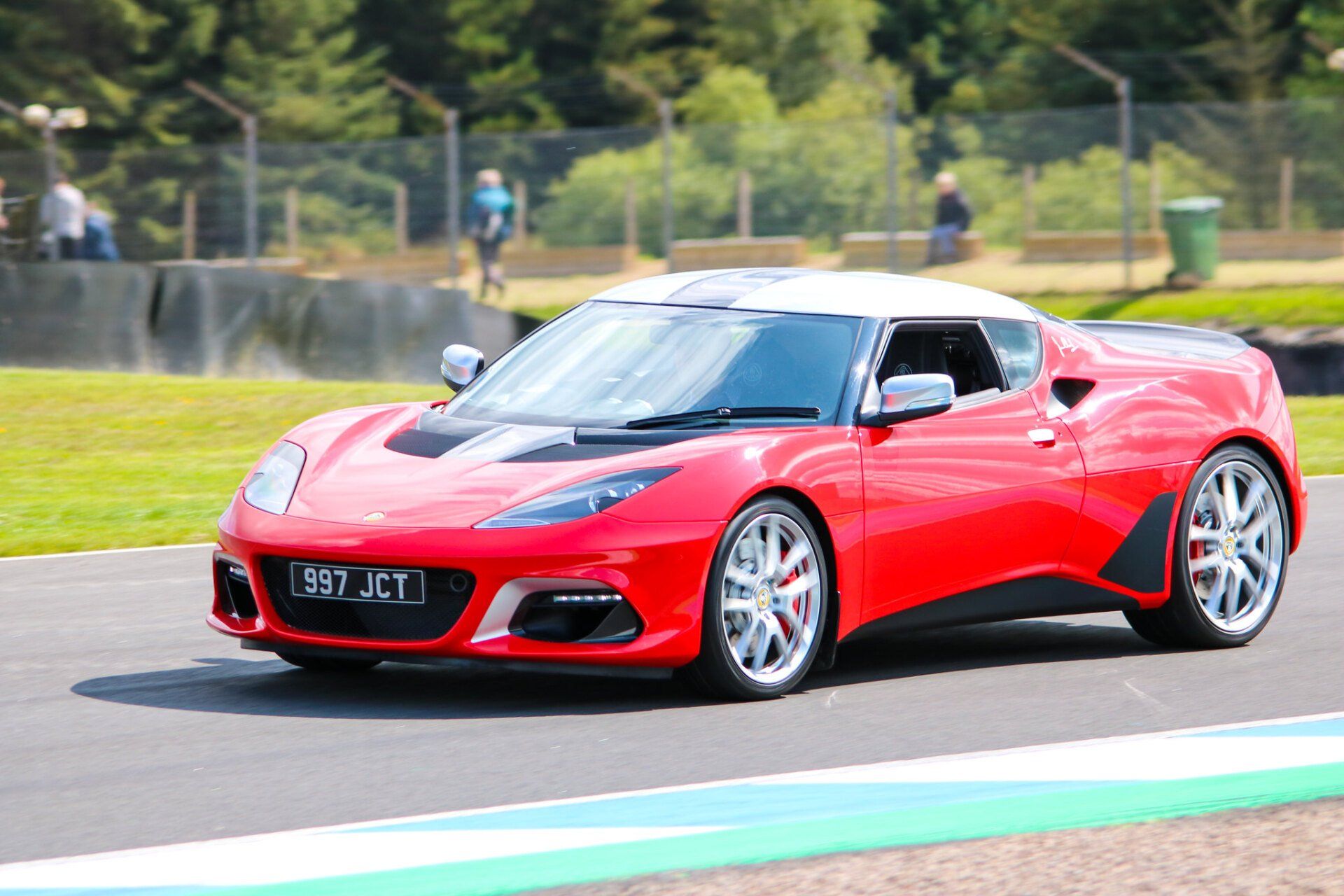 A red sports car with a license plate that says rd jet