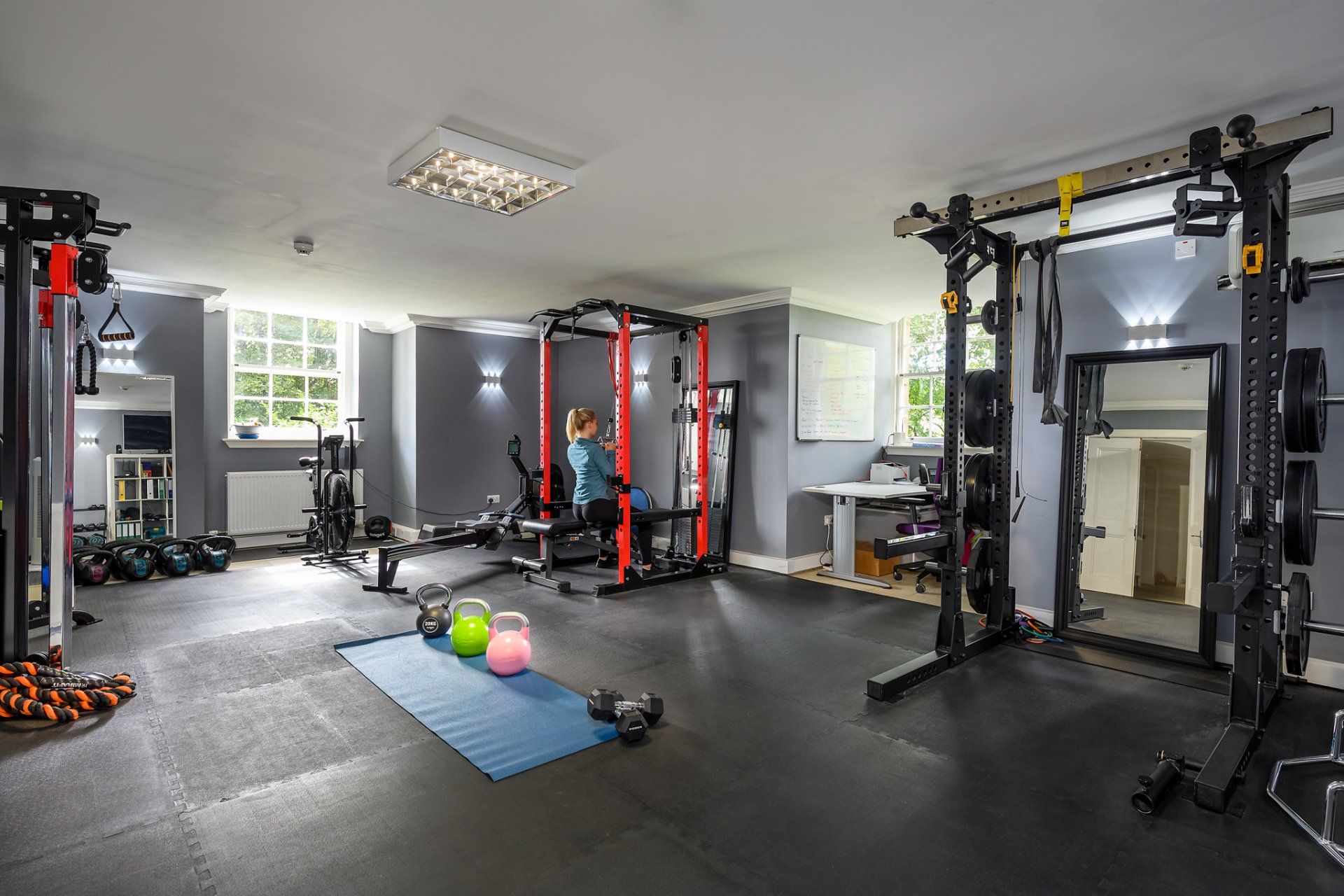 A large gym with a lot of exercise equipment