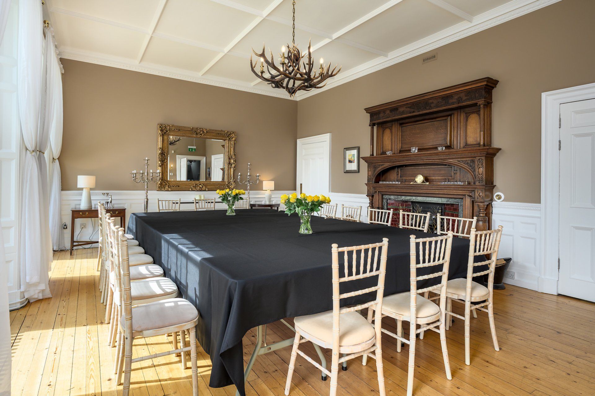 A large room with a long table and chairs