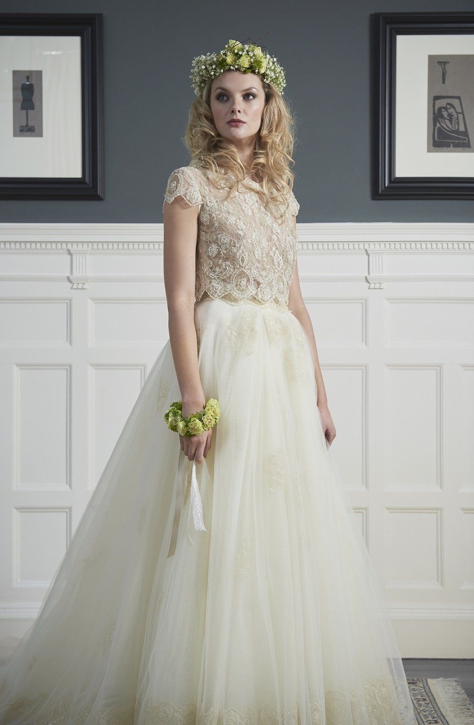 A woman in a wedding dress with a flower crown on her head