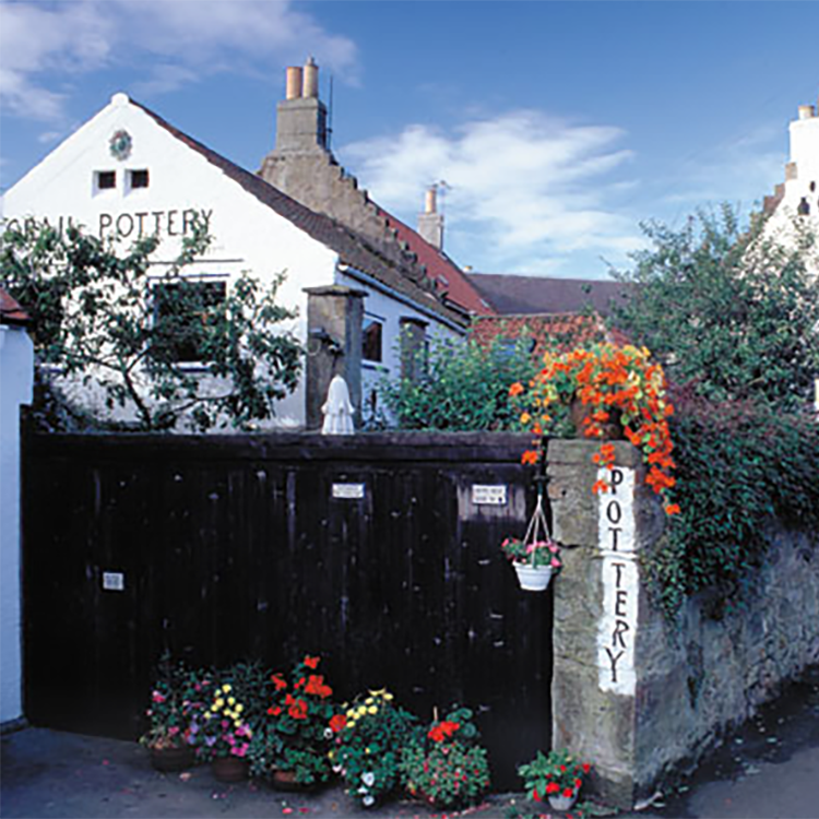 A white building with the word pottery on it
