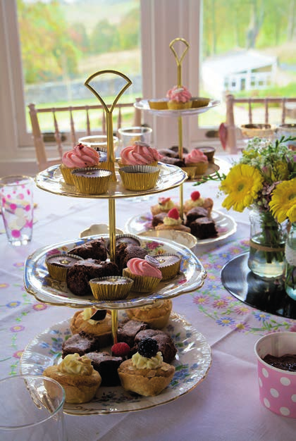 A display of cupcakes and pastries on a table