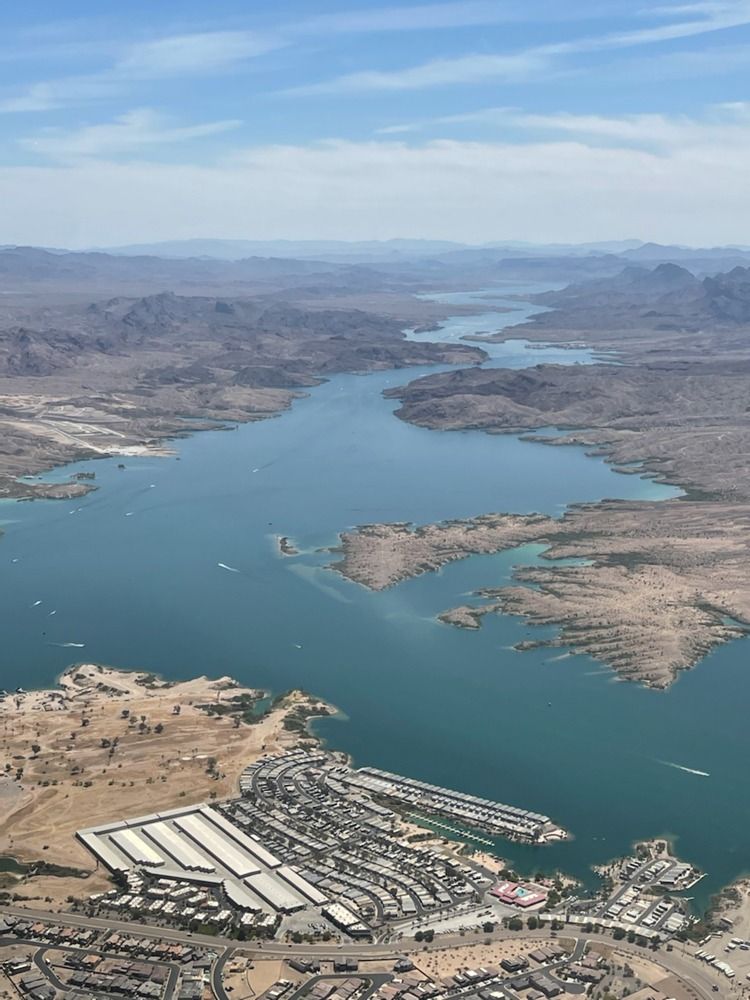 An aerial view of a large body of water surrounded by mountains