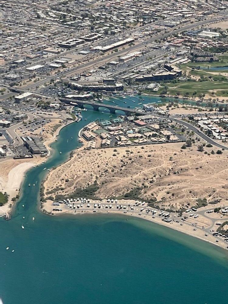 An aerial view of a large body of water surrounded by a city.