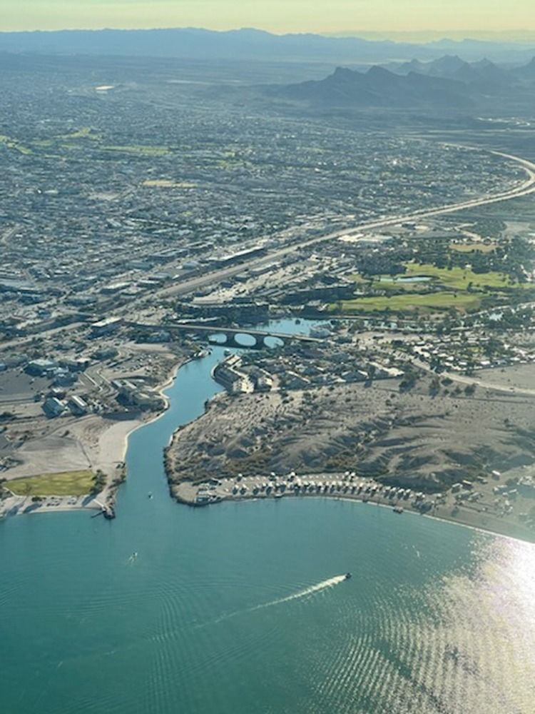 An aerial view of a city and a body of water