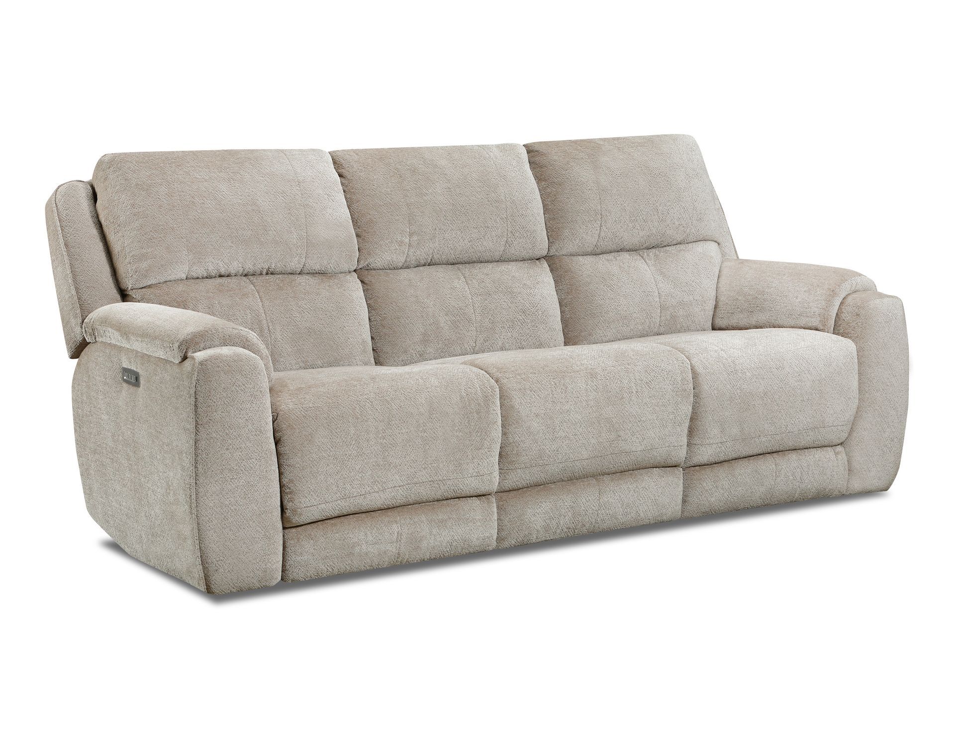 A beige, three-cushion reclining sofa with tufted backrests.