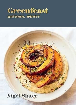 Cover of “Greenfeast autumn, winter” by Nigel Slater, showing a roasted squash dish on a white plate