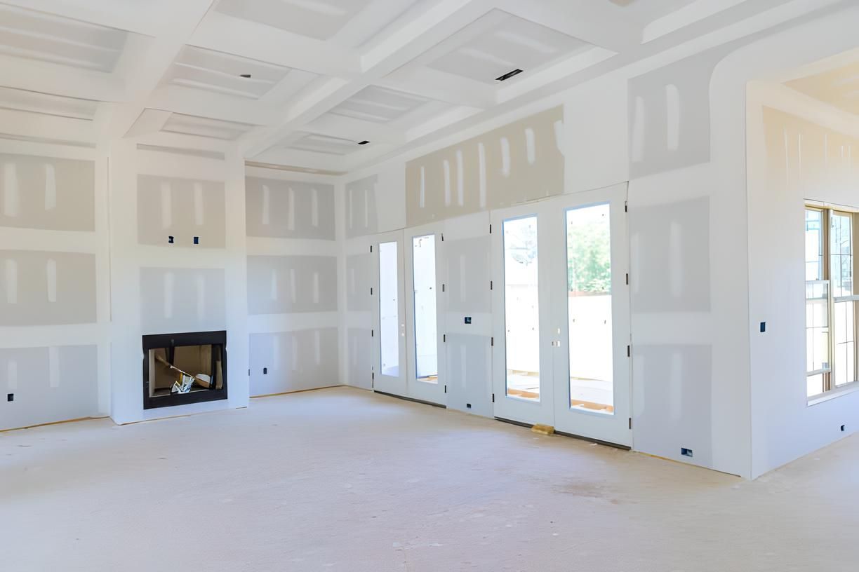 An empty room new drywall with a fireplace and a lot of windows