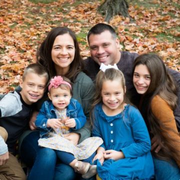 A close up of a bunch of flowers with a dark background.