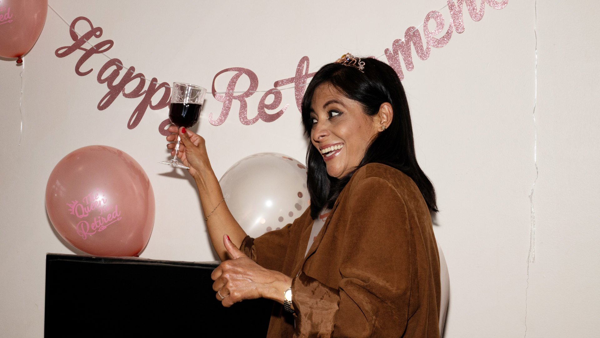 A silver plate with a napkin on it is on a striped table cloth