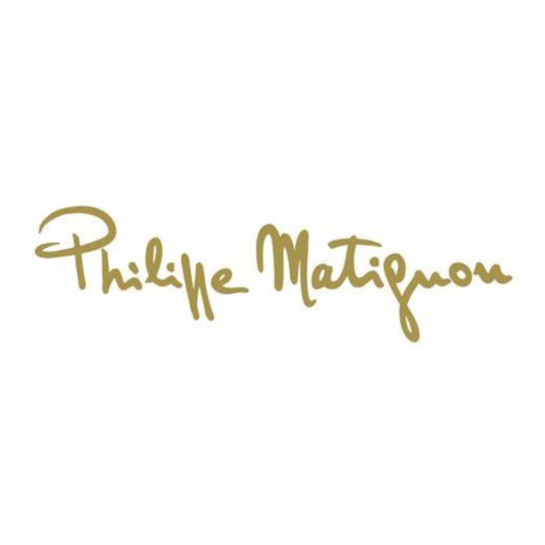 Il logo di philippe matignon è scritto in oro su sfondo bianco.