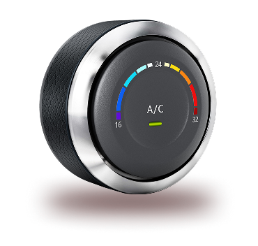 A circular digital climate control dial with a chrome trim, displaying an A/C setting with a colored temperature gradient. | Integrated Automotive