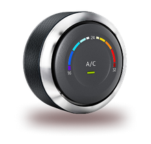 A circular digital climate control dial with a chrome trim, displaying an A/C setting with a colored temperature gradient. | Integrated Automotive
