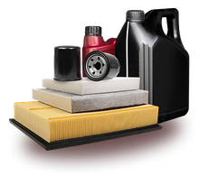 A collection of automotive maintenance supplies including oil filters, a bottle of motor oil, and three flat air filters. | Integrated Automotive