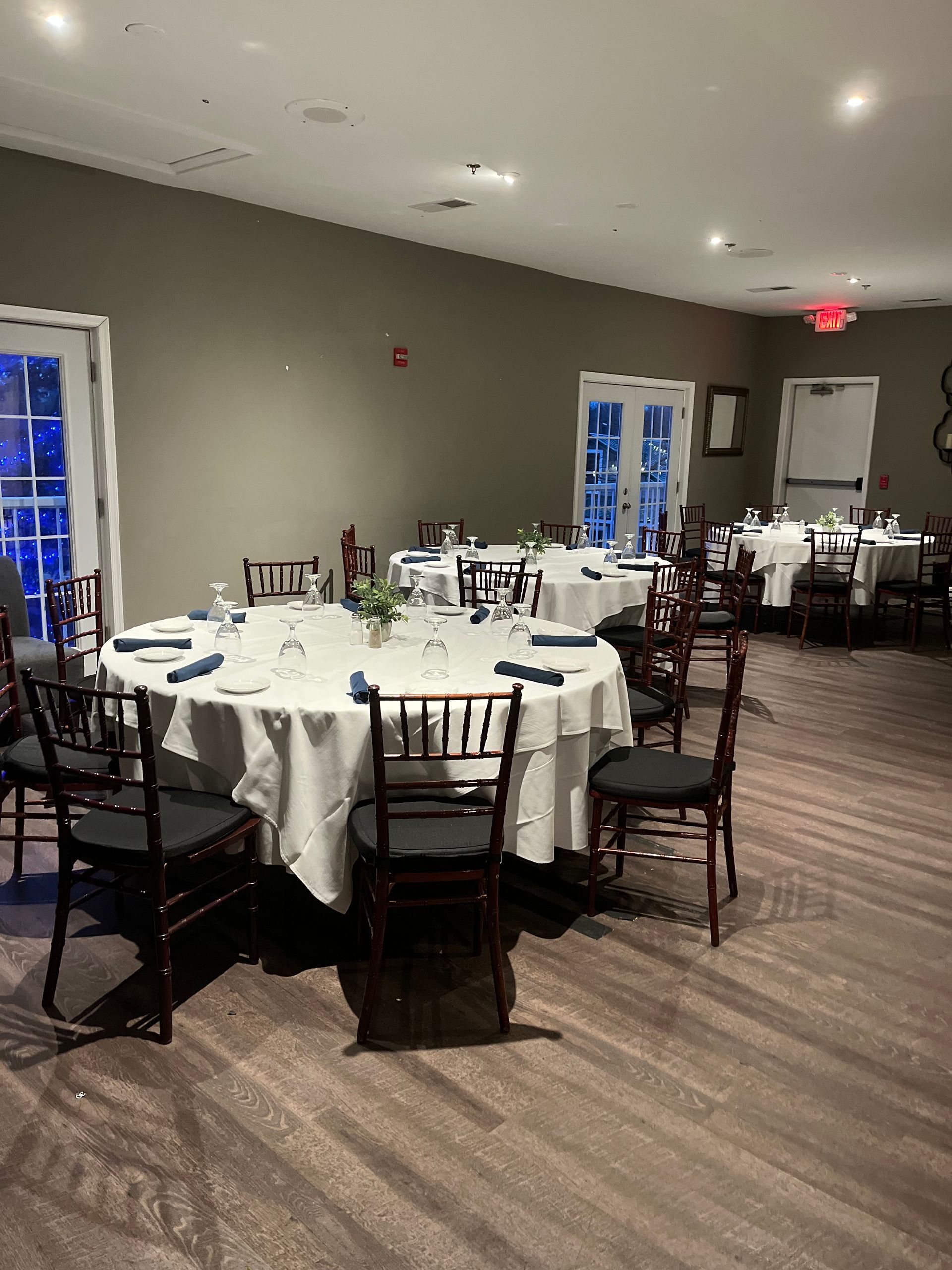 A large room with tables and chairs set up for a wedding reception.| Brookeville, MD | Silo Falls