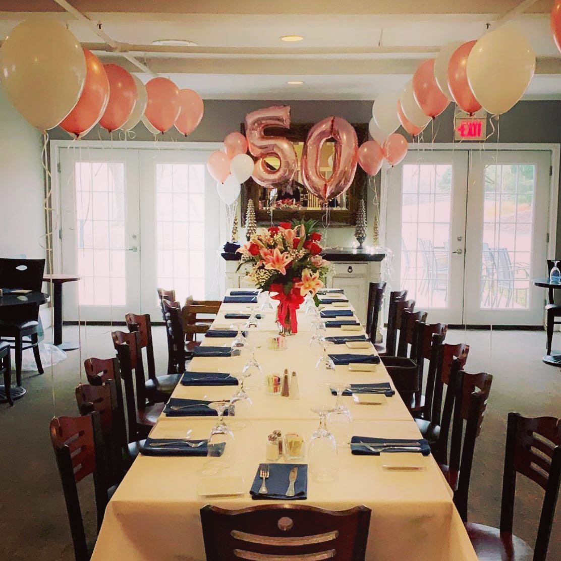 A long table with 50 balloons hanging from the ceiling | Brookeville, MD | Silo Falls