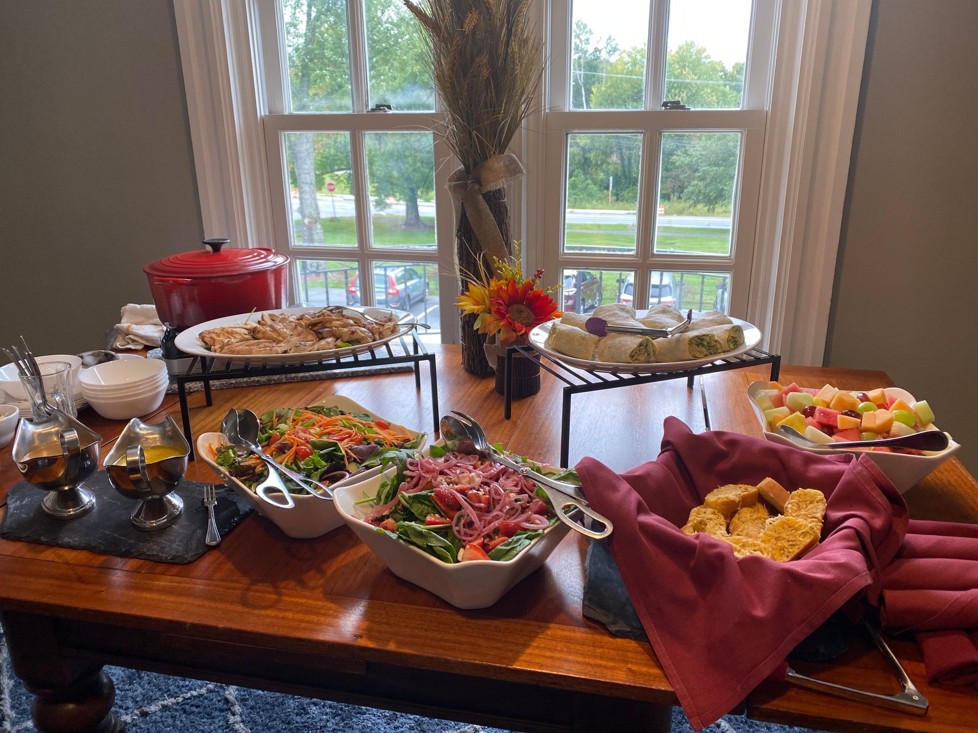 A table with a variety of food on it in front of a window. | Brookeville, MD | Silo Falls
