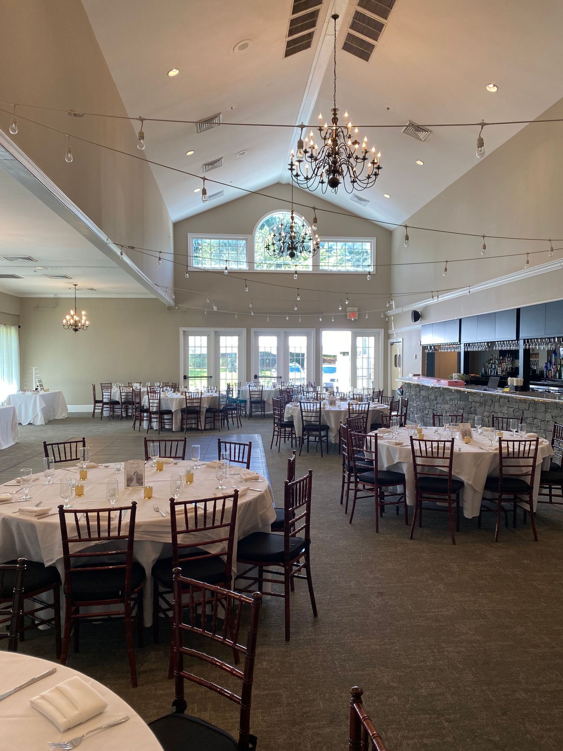 A large room with tables and chairs set up for a wedding reception | Brookeville, MD | Silo Falls