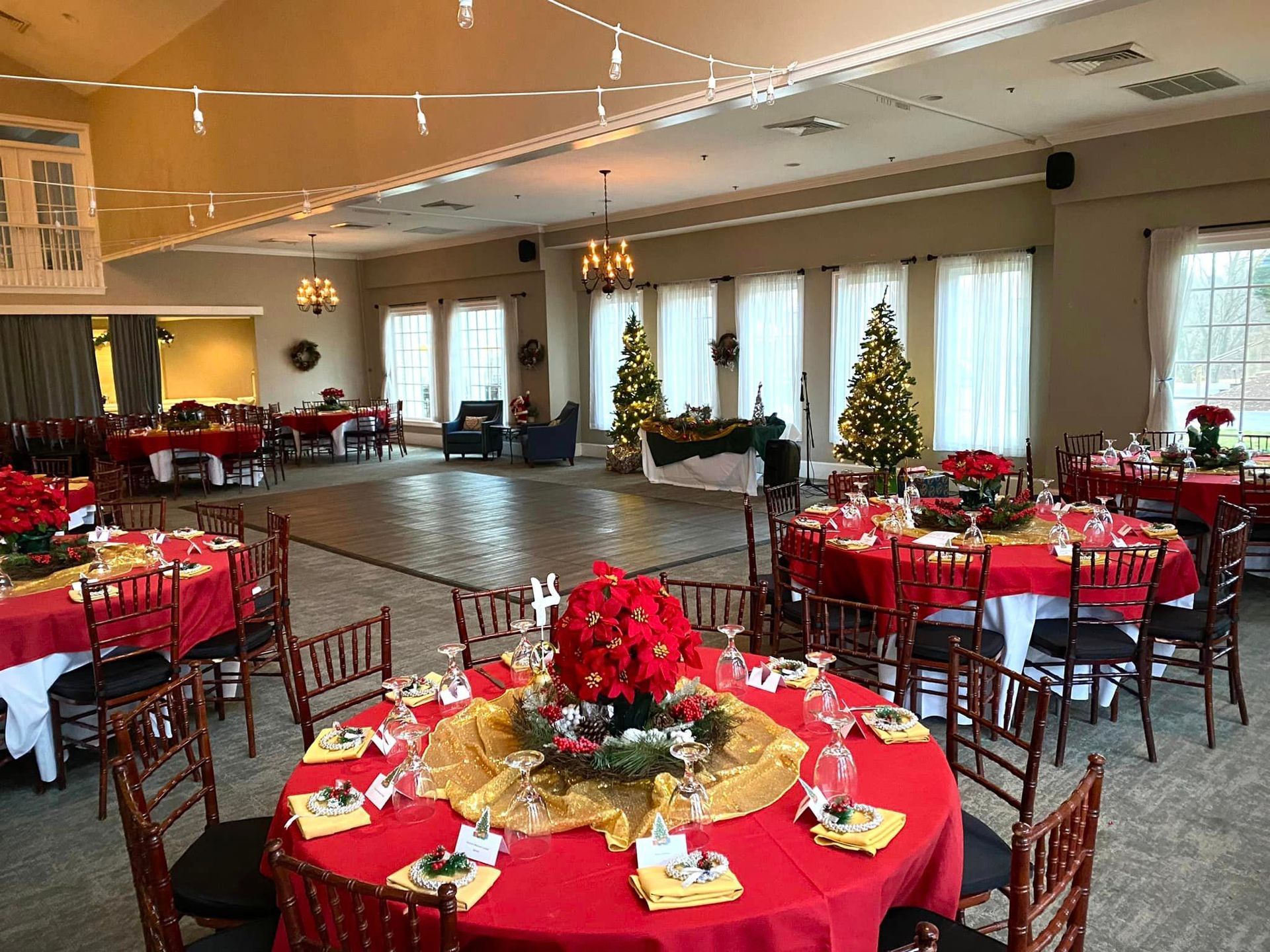 A large room with tables and chairs set up for a christmas party. | Brookeville, MD | Silo Falls